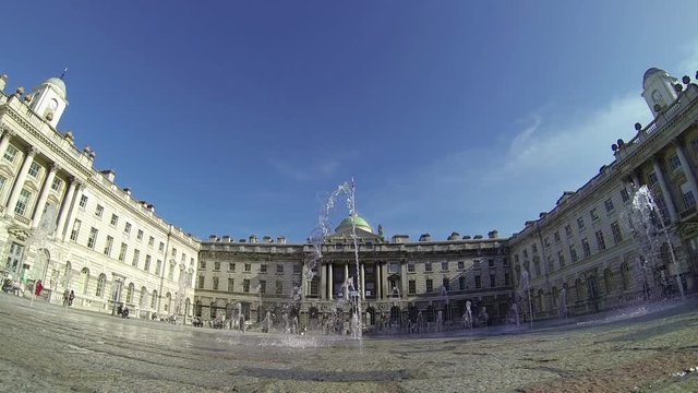 Footage view of spurting water fountains by Somerset House in London, UK on a sunny day. Ultra wide angle view. 