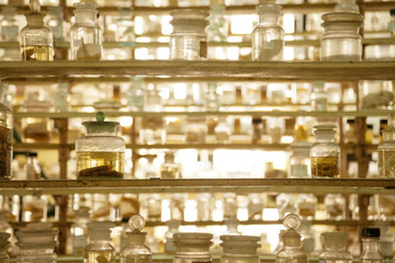 Museum shelves with specimens preserved wet in glass jars of formalin. Jarred animals in a...