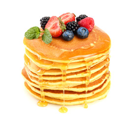 Pancakes stack with different berries and honey isolated on white background