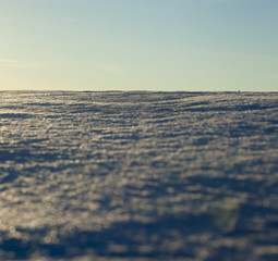 uneven drifts of white snow