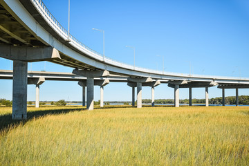 Long concrete bridge foundation crossing marsh area