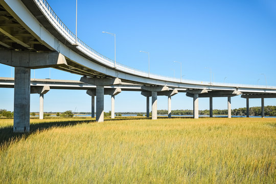 Long concrete bridge foundation crossing marsh area