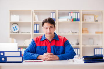 Worker in uniform working on project