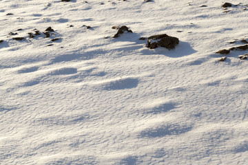 covered with snow plowed earth ,