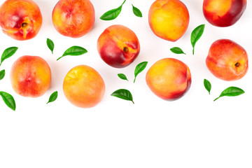 ripe nectarine with leaves isolated on white background. Top view. Flat lay pattern