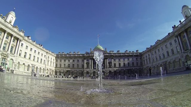 Footage view of spurting water fountains by Somerset House in London, UK on a sunny day. Ultra wide angle view. 