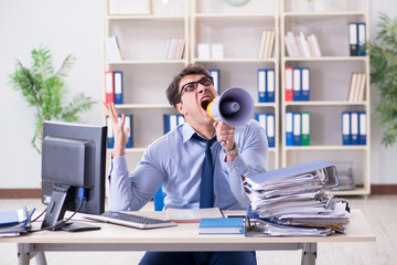 Stressful businessman working in the office  