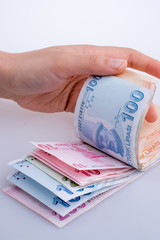 Hand holding Turksh Lira banknotes  in hand