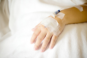 Focus patient's hand has get the saline solution syringe on it. Illness and treatment. Health...