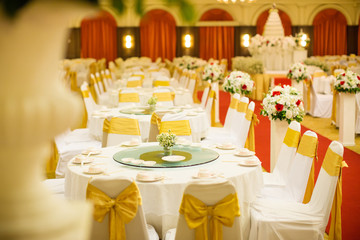 wedding table sets in wedding hall. wedding decorate preparation. table set and another catered event dinner, luxury wedding table setting for fine dining at outdoors.