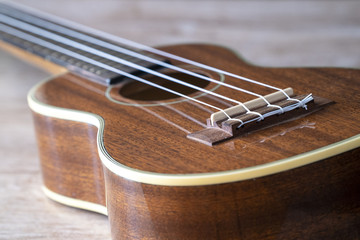 Ukulele on a wooden floor // still life