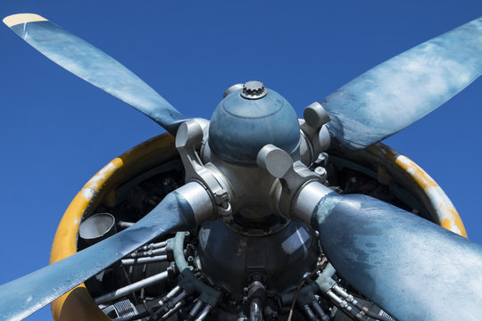 Airplane propeller on blue sky background