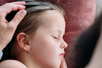 parenting lifestyle. dad caressing his sleeping daughter head. true endless love care and...