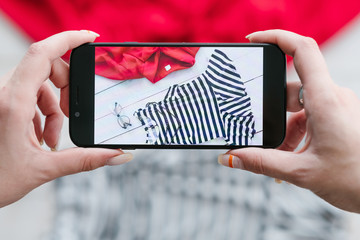 fashion blogger taking photos of clothing. social media influencer creating content for her...