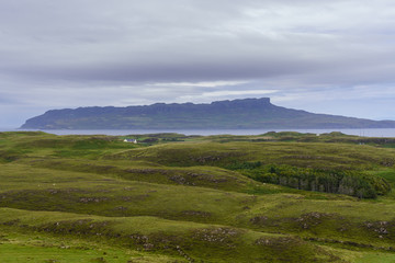 Fototapeta na wymiar The Isle of Eigg as seen from the island of Muck. Eigg is one of the Small Isles, in the Scottish Inner Hebrides.
