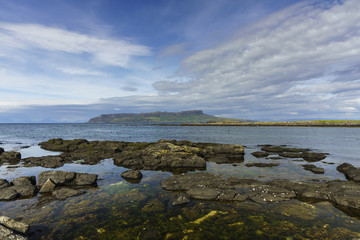 Fototapeta na wymiar The Isle of Eigg as seen from the island of Muck. Eigg is one of the Small Isles, in the Scottish Inner Hebrides.