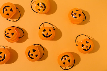 Halloween pumpkins overhead view on a solid color