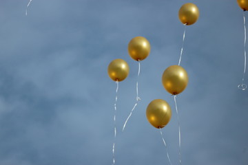 Golden baloons in the sky