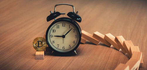 Investment concept, Falling bitcoin after dominoes effect with timer clock