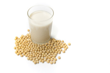 Above view of soy milk with soybean on the spoon isolated on white background. Have a copy space ready for your text.