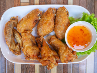 chicken fried in white plate on table