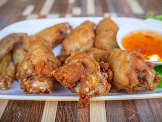 chicken fried in white plate on table