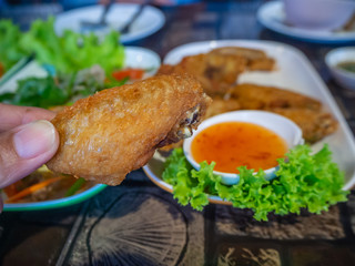 chicken fried in white plate on table