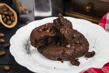 Homemade chocolate cookies on wooden table background. Food baking.