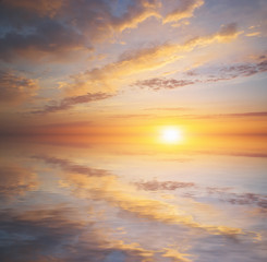 Naklejka na ściany i meble Sky background and water reflection on sunset.