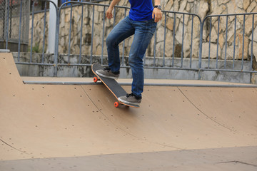 Skateboarding on skatepark ramp