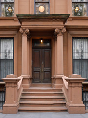 front steps to New York brownstone style apartment building