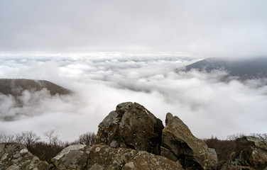 A blanket of fog sets on the Shenandoah Mountains, with the mountain peaks visible from the highest summit in the park.