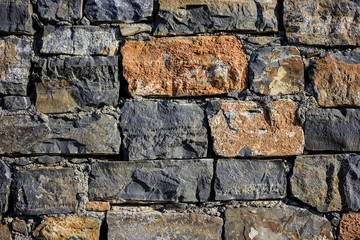 Granite wall texture ,seamless texture, masonry. day, multi-colored granite natural stone, pieces of stone, splinters,