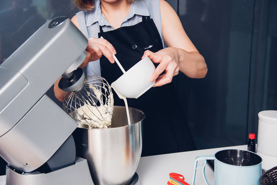 Woman making mixer bakery cake machine