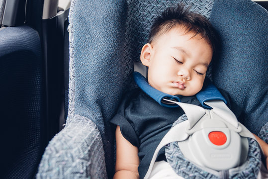 Asian Baby Boy Travel In Car Seat And Sleeping