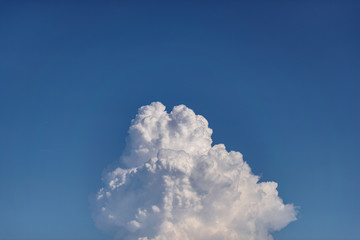 Cumulonimbus clouds in the clear blue sky