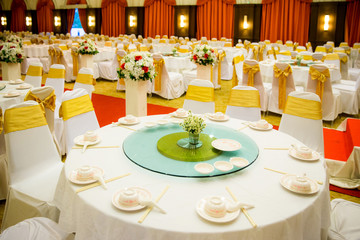 wedding table sets in wedding hall. wedding decorate preparation. table set and another catered event dinner, luxury wedding table setting for fine dining at outdoors.