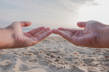 showing the ocean with your hands