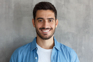 Close up portrait of young happy smiling friendly man