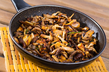 Frying pan with freshly fried mushrooms