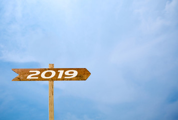 Sign banner 2019 Isolated  blue sky background.Wooden sign isolated on blue sky