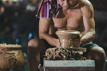 Thai old man made traditional earthenware