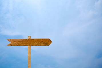 Empty signage isolated blue sky background.Wooden sign isolated on sky