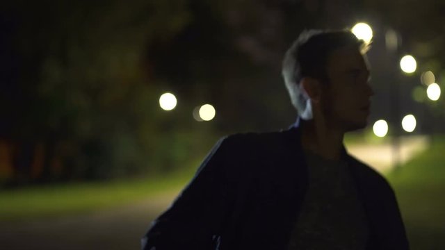 The man runs away from the chase. evening night time