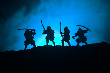 Silhouette of two samurais in duel. Picture with two samurais and sunset sky © zef art