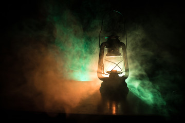Oil Lamp Lighting up the Darkness or Burning kerosene lamp background, concept lighting. Selective focus