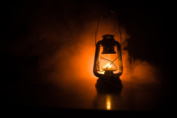 Oil Lamp Lighting up the Darkness or Burning kerosene lamp background, concept lighting. Selective...