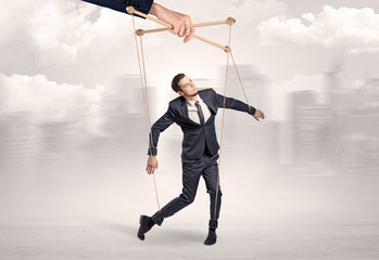 Puppet man with big city great power concept
