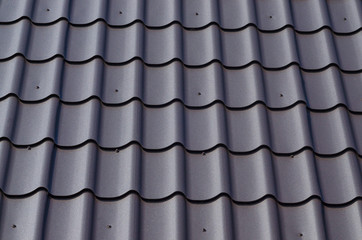 Slate roof as background. Metal tile roof surface, background, texture, abstract