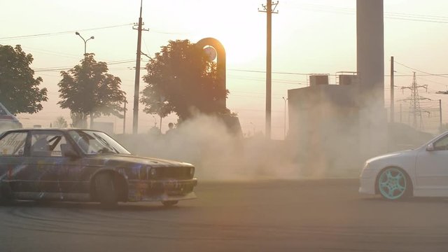 HD: Racing car enters into turn putting dust up. Slow motion